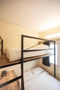 Postel nebo postele na pokoji v ubytování Fragrance Hotel - Balestier
