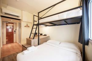 Postel nebo postele na pokoji v ubytování Fragrance Hotel - Balestier