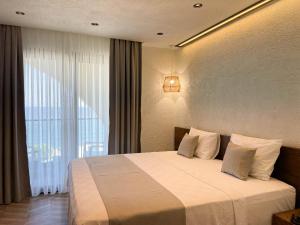 Кровать или кровати в номере Now Boutique Hotel