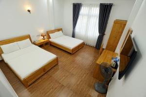 Voodi või voodid majutusasutuse Maxim Hotel toas