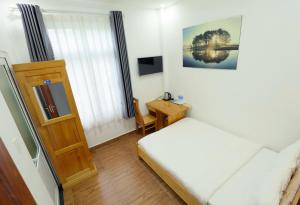 Voodi või voodid majutusasutuse Maxim Hotel toas