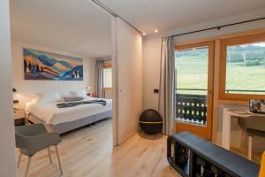 Postel nebo postele na pokoji v ubytování Hotel Funivia