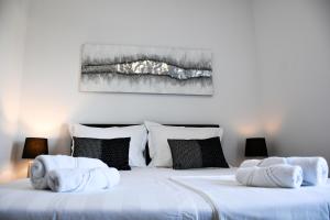 Postel nebo postele na pokoji v ubytování Villa Luna&Aurora + 37 fotografií