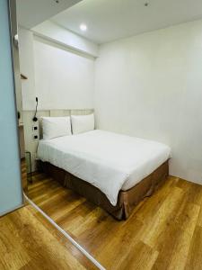 Postel nebo postele na pokoji v ubytování Apause Inn