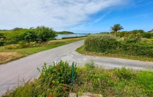an empty road with a view of the ocean at 4 Bedroom Gorgeous Home In Sibiril in Sibiril +27 photos