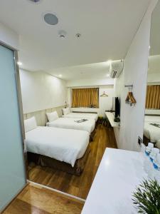 Postel nebo postele na pokoji v ubytování Apause Inn
