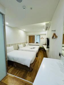 Postel nebo postele na pokoji v ubytování Apause Inn