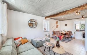 a living room with a couch and a table at Kaisermantel in Irrhausen