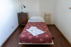 Voodi või voodid majutusasutuse Un balcone su Spello toas