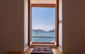 a window with a view of a body of water at 1 Bedroom Nice Apartment In Baska in Baška