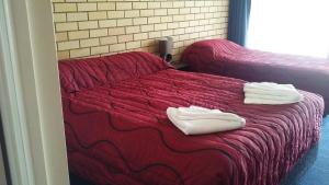 Postel nebo postele na pokoji v ubytování Nambour Central Motel + 8 fotografií
