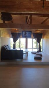 a living room with a couch and a table at Casa Cristian in Limanu