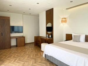Кровать или кровати в номере Now Boutique Hotel