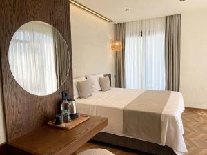 Кровать или кровати в номере Now Boutique Hotel