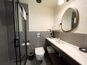 Ванная комната в Now Boutique Hotel