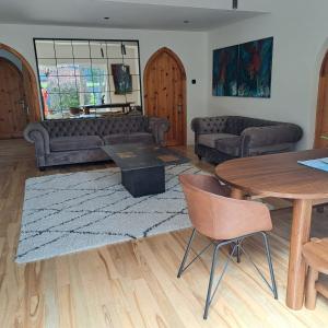 a living room with a couch and a table at Knockillaree in Galway