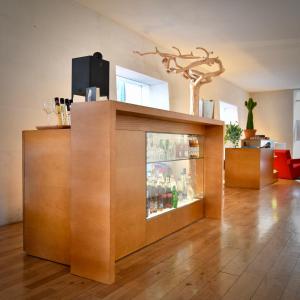 a large wooden entertainment center in a living room at Hôtel La Pérouse in Nantes