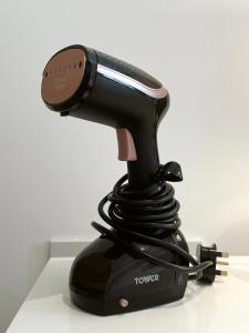 a black hair dryer sitting on top of a counter at Stylish City Centre Studio - Grand Central House in Gibraltar