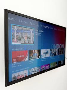 a flat screen tv hanging on a wall at Stylish City Centre Studio - Grand Central House in Gibraltar