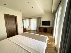 Кровать или кровати в номере Now Boutique Hotel