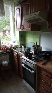 a kitchen with a stove with pots and pans on it at nice home in Warsaw