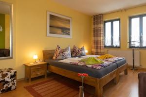a bedroom with a bed in a room at Stadthaus Waren in Waren