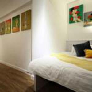 Uma cama ou camas num quarto em Apple lnn Causeway Bay