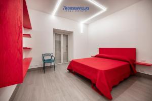 Un pat sau paturi într-o cameră la House&Villas - La Casa dei colori