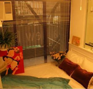 Uma cama ou camas num quarto em Apple lnn Causeway Bay