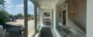 a glass balcony with a view of a patio at Nuova Opera Rooms & Apartments in Verona