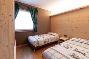 Posteľ alebo postele v izbe v ubytovaní Chalet Ceppo