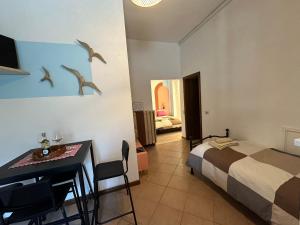Postel nebo postele na pokoji v ubytování Agriturismo Podere I' Caldino
