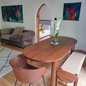 a living room with a wooden table and chairs at Knockillaree in Galway
