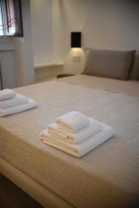 Giường trong phòng chung tại Dimora in borgo