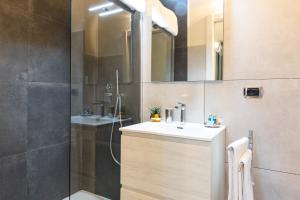 a bathroom with a sink and a shower at Città Studi Suites - Top Collection in Milan