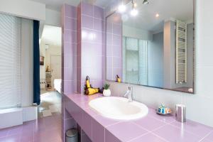 a bathroom with a sink and a mirror at Città Studi Suites - Top Collection in Milan
