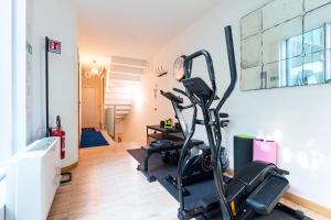 a room with a gym with a treadmill at Città Studi Suites - Top Collection in Milan