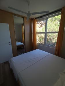 Postel nebo postele na pokoji v ubytování Apartmani Ribar