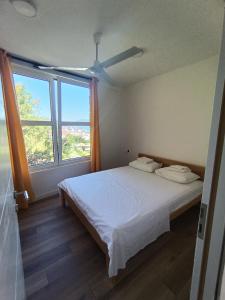 Postel nebo postele na pokoji v ubytování Apartmani Ribar