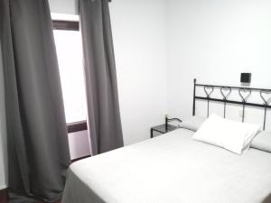 Posteľ alebo postele v izbe v ubytovaní Hostal Cuzco