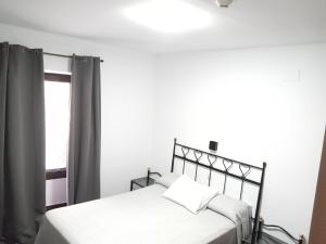 Posteľ alebo postele v izbe v ubytovaní Hostal Cuzco