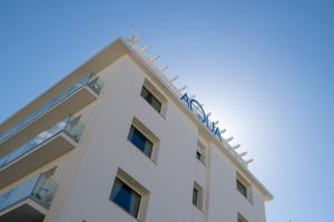 an image of a white building at Hotel Aqua in Cattolica