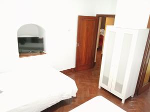 Posteľ alebo postele v izbe v ubytovaní Hostal Cuzco