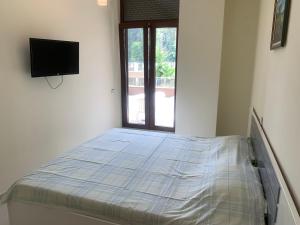 En eller flere senge i et værelse på Beach Apartment + 48 billeder