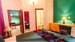 Letto o letti in una camera di Au Cabaret Vert