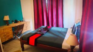 Letto o letti in una camera di Au Cabaret Vert