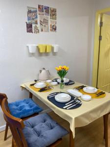 a dining room table with plates and utensils at Haekong's House in Seoul