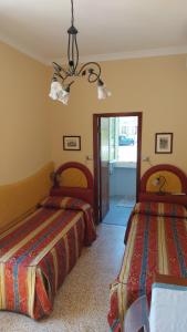 Postel nebo postele na pokoji v ubytování Albergo Regina