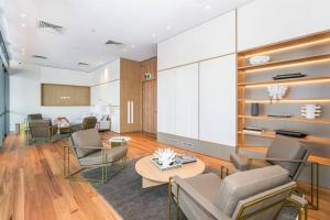 a living room with couches and a table at Bliss At Signature in Gold Coast