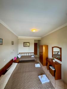 Postel nebo postele na pokoji v ubytování Hotel Filoxenia